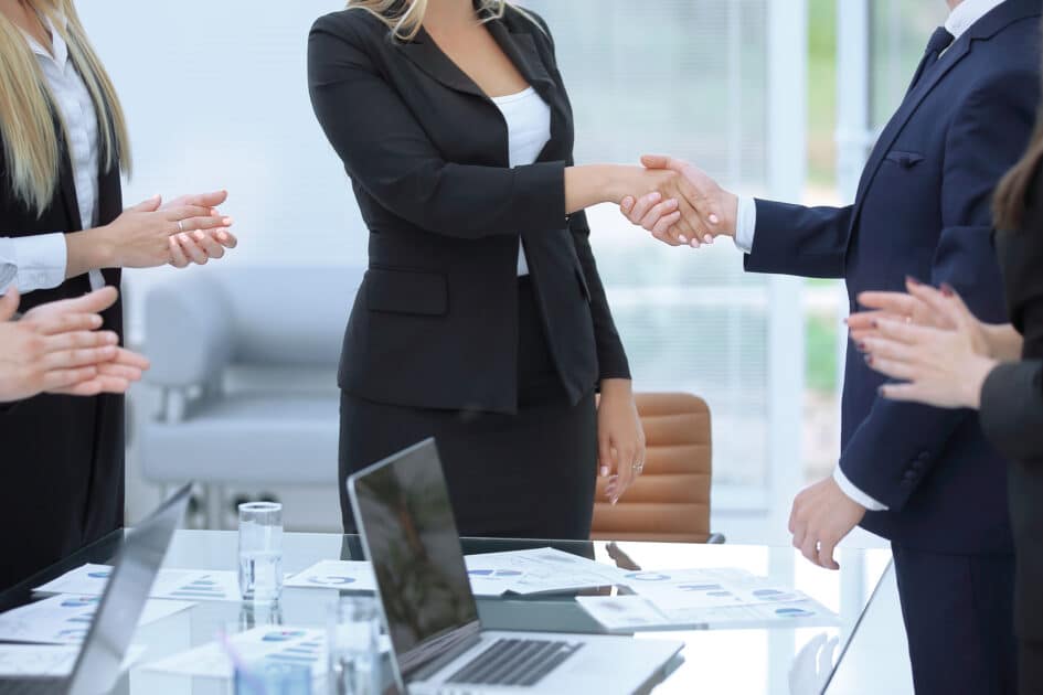Master in Business Administration (Professional Track) close up. handshake of young business people