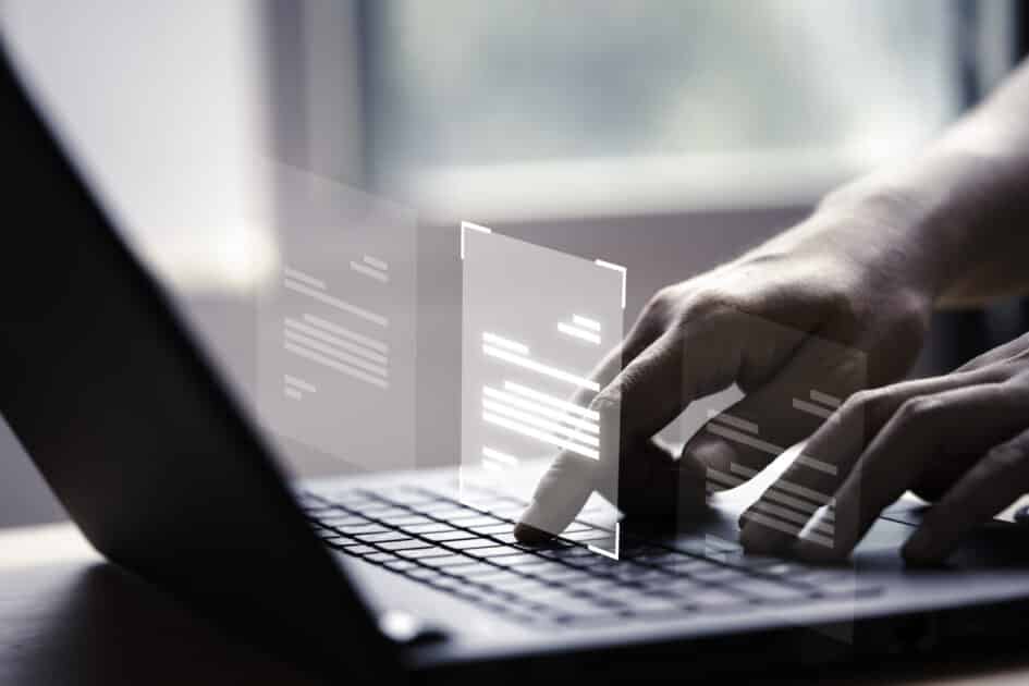 Master in Information Technology (Systems Administration) Hand using laptop computer with virtual screen and document for