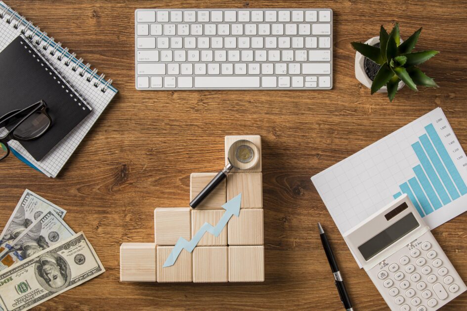 Doctor of Business Administration top-view-business-items-growth-arrow-with-keyboard